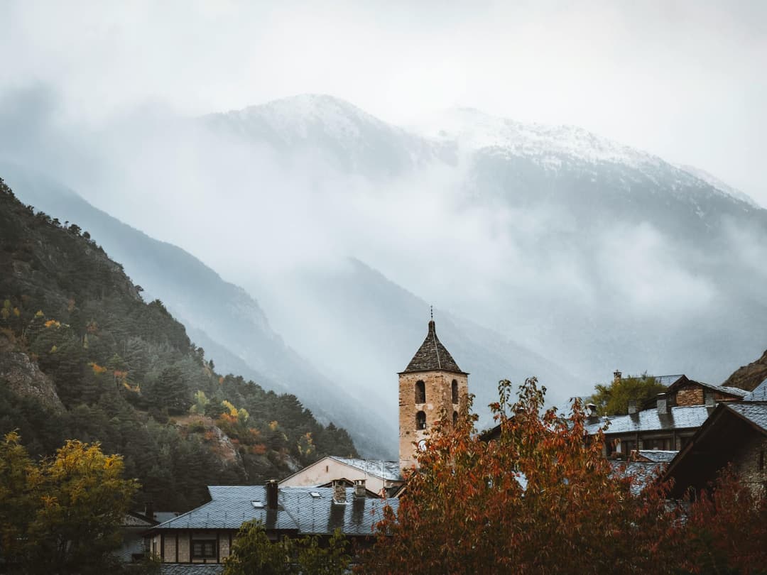 Church Tower in front of mountains in Ordino Andorra