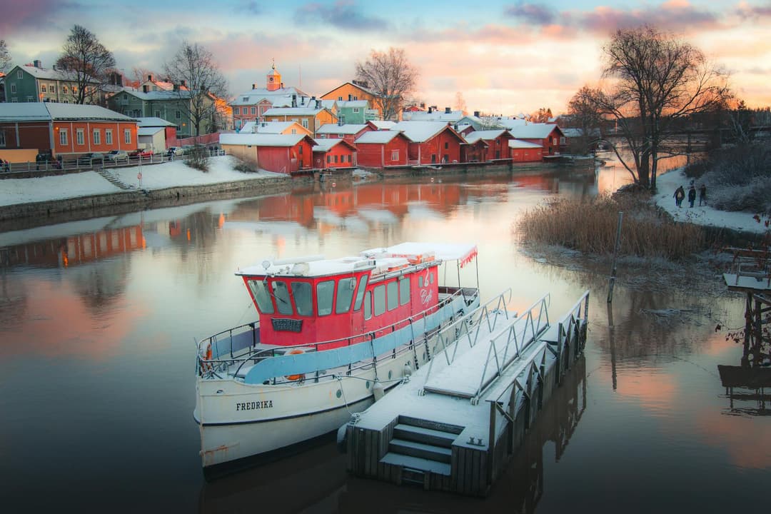 White Boat on Water Near Houses