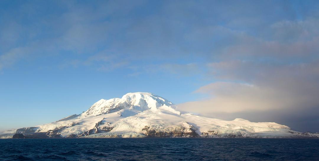 A snowy volcano island