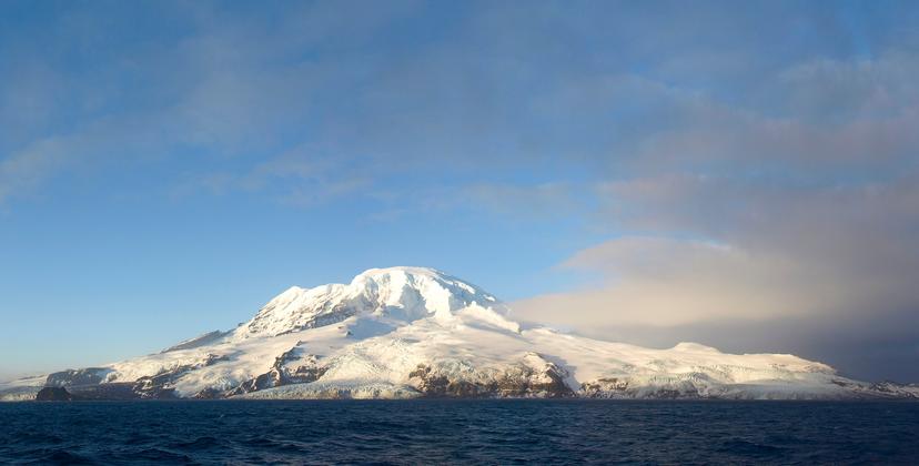 A snowy volcano island