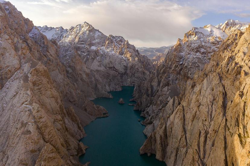 Lake Kol Suu surrounded by mountains in Kyrgyzstan