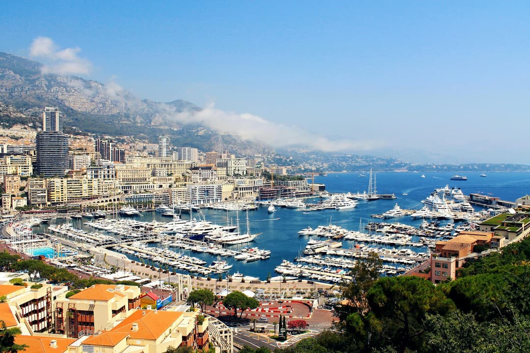 Boat Lot on Calm Body of Water Beside Monaco Houses