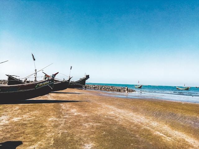 Brown boat on sea shore