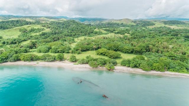 Aerial view of the World War 2 shipwreck of a Japanese transport ship (Kinugawa Maru) that lies just off Bonege ii beach on Guadalcanal island.